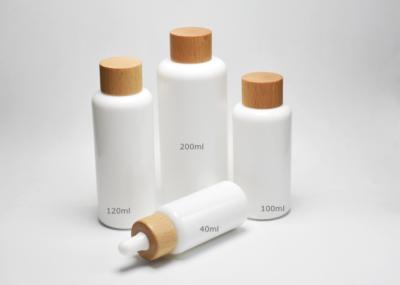 China Jade White 40, 100, 120ml Boston Round Opal Glass Bottles With Wooden-Plastic Clousures, Glass Primary Medical Packaging for sale
