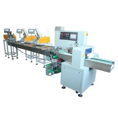 China Hot Product Fast Sealing Cutting PE Film Pillow Shape Paging Paper Packing Machine Wrapping Packaging Machine for sale