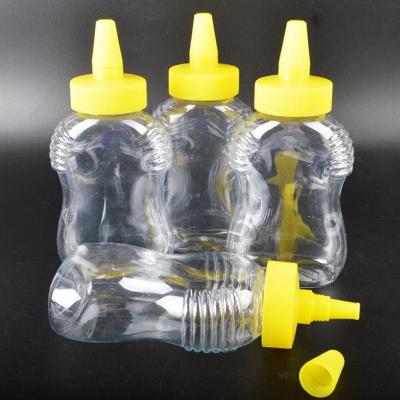 China Material transparente de la entrerrosca de la boca de la miel de la botella del animal doméstico plástico agudo de la categoría alimenticia en venta