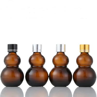 China Brown Glass Bottles Containers High Sealing Performance Amber Gourd Shape for sale