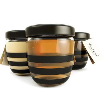 China Honey Glass Storage Jars Honey Bottles Empty Round Small Glass Honey Containers for sale
