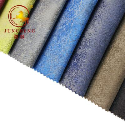 China 100 polyester glue embossed super soft velvet fabric for furniture à venda