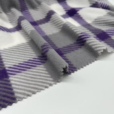 China Imprimir tecido de lã polar para vestuário cobertor têxtil doméstico à venda