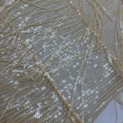 China Glinsterende geborduurde stof 100% polyester goud doek voor vrouwen avondjurken Te koop