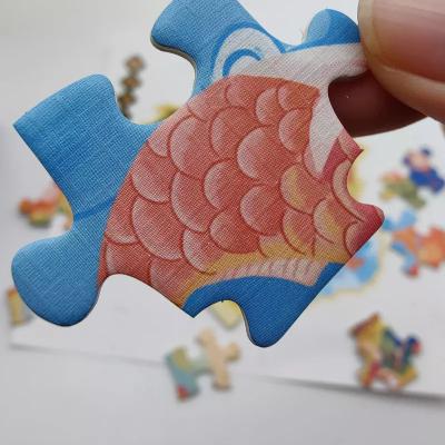 Китай Изготовители головоломки изображения мультфильма оптовые с коробкой упаковывая изготовленный на заказ напечатанный зигзаг части 50-200 продается