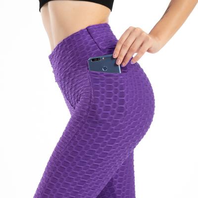 China Elastic Fitness Gym Seamless Butt Lifting Leggings With Pocket for sale