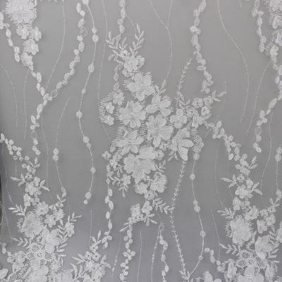 China Delicate Embroidery Polyester On Nylon Mesh Lace Fabric With 3D Flower Design for sale
