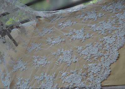 China Floral Beaded Corded Lace Fabric , Ivory Embroidered Lace Fabric With Wavy Edging for sale
