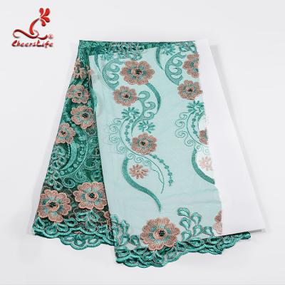 China Luxuriant Embroidery Stones Floral Lace Fabric For Fashion Clothing for sale