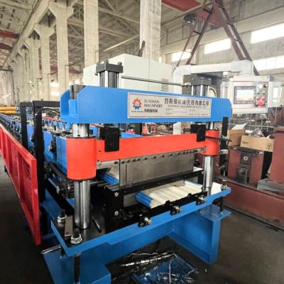 China Automatic 457-610mm Width Adjust Non Insulated Steel Garage Door Panel Roll Forming Machine for sale