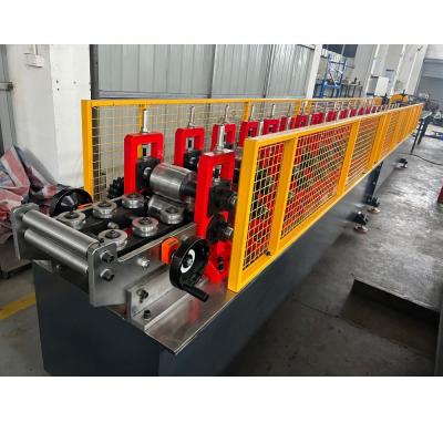 China 0.7-1.2mm Galvanized Steel Metal Shutter Bottom Roll Forming Machine with Stop Saw Cutting for sale