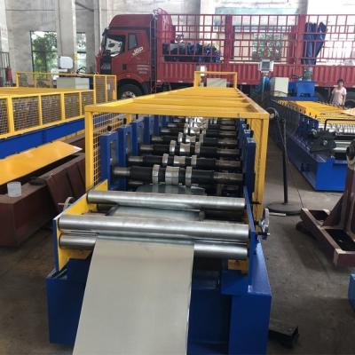 China 4KW Hydraulic Punching Ridge Cap Roll Forming Machine Chain Transmission for sale