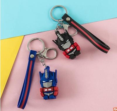China Keychain Optimus Robot Men And Women Doll Couple Key Chain for sale
