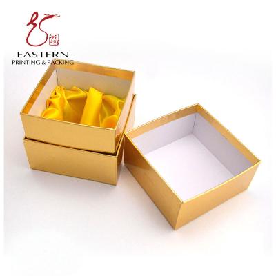 China Luxury Gold Color Handmade  120gsm Candle Packaging Box With Silk Insert for sale