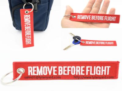 China Custom Embroidery Logo Remove Before Flight Keychain, Woven Logo Keychain, Red Remove Before Flight Keychain with Ring for sale