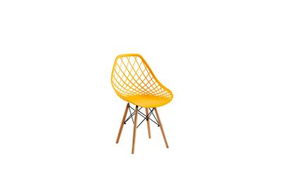 China Casual Hollow Eames Plastic Dining Chair 48*43*83cm Solid Wood Legs for sale