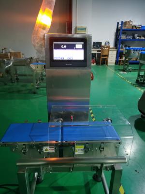 China Alto pesador en línea del control de la exactitud 200WPM para los productos del embalaje del bolso de la botella en venta