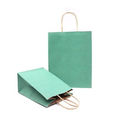 China Plain Paper T Shirt Bags With Handles UV Coating Spot Varnishing Finishing for sale