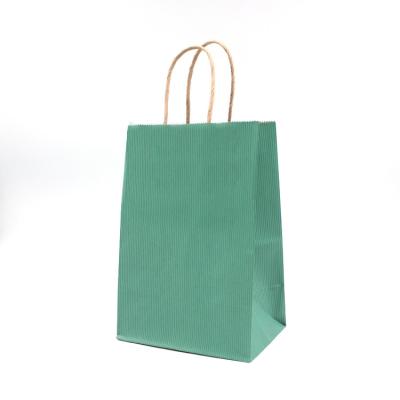 China Kraft Handle Paper T Shirt Bags CMYK Pantone Color Sustainable for sale