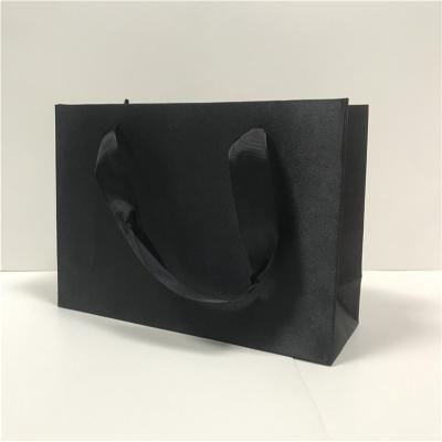 China Matte Texture Jewelry Paper Bags PP Nylon Handle PMS Embossing Paper Gift Bags for sale