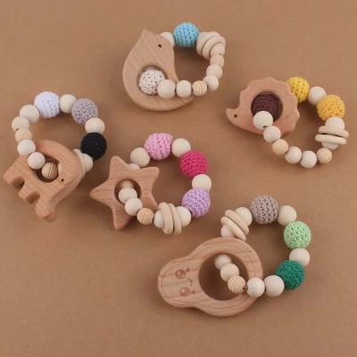 China Wholesale Baby Crochet Beads Teether Shower Gift Wooden Ring Rattles Baby Silicone Teething Bracelet for sale