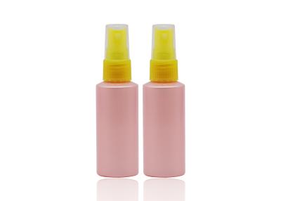 China Flat Shoulder Pink PET 50ml Small Plastic Spray Bottles Refillable With Yellow Pump for sale