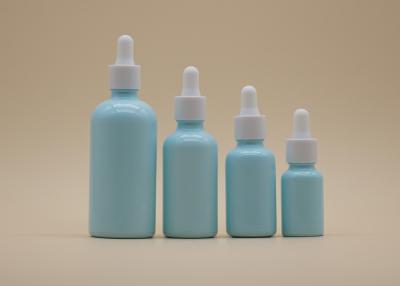 China Blue Coating Essential Oil Dropper Bottles White Ceramic Bottle For Personal Care for sale