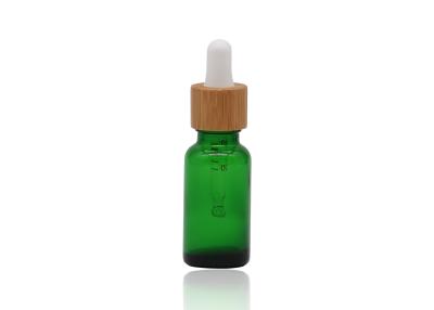China Green Oil 18mm Cosmetic Glass Dropper Bottles With Bamboo Dropper Printing Pipette for sale