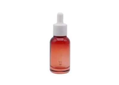 China La botella de aceite esencial de cristal roja clara 30ml 50ml 100ml heló la botella cosmética clara del dropper en venta