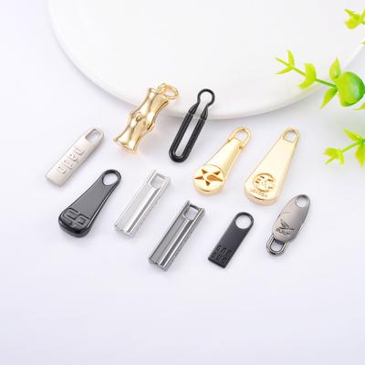 China Customized Metal Zipper Puller Charm for Handbags Zinc Alloy Zipper Slider and Puller for sale