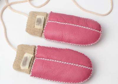 China Warmest Hand Sewn Baby Sheepskin Mittens With Light Pink Cuff for sale
