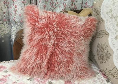 中国 モンゴルの毛皮の枕家の装飾の本物のモンゴルのチベットの羊皮の子ヒツジのウールのピンクの投球枕 販売のため