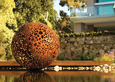 China Delicate Corten Steel Carved Hollow Ball Sculpture For Garden Decoration for sale