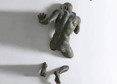 China Life Size Patina Cast Bronze Wall Mounted Man Sculpture for sale