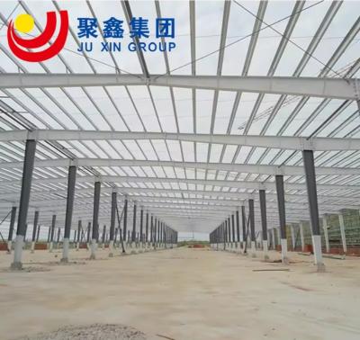 China Reliable Prefab Warehouse Building Light Metal Sloping Roof for sale