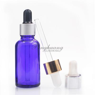 China Cylindrical 30ml Blue Oil Dropper Glass Bottle With Gold Dropper for sale
