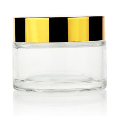 China 50g Glass Jar Cream Glass Jar With Gold Cap for sale