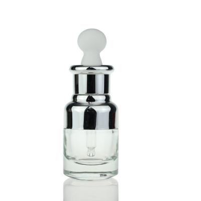 China Luxury 35ml Serum Dropper Bottles With Silver Pump Lid Press Dropper Cap for sale