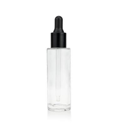 China Clear Glass 30ml Serum Dropper Bottles Matte Black Cap Cosmetic Packaging Bottle for sale