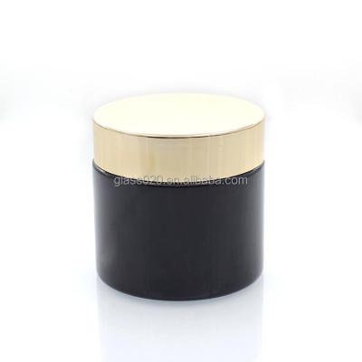 Cina Materiale di vetro d'imballaggio del barattolo nero lucido della crema 60g con il coperchio di plastica in vendita