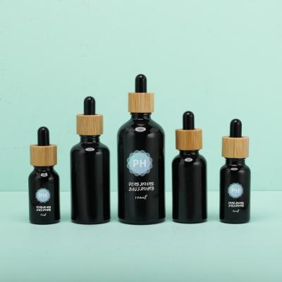 China Round 5ml Bamboo Black Essential Oil Dropper Bottle for sale