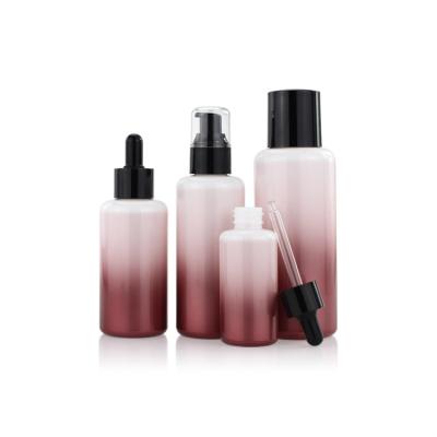 China 50ml 100ml Empty Round Gradient Lotion Glass Bottle Set for sale
