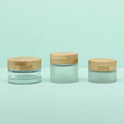 China Face Cream Packaging Glass Cosmetic Cream Jar 30g With Screw Bamboo Cap for sale