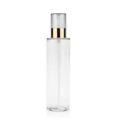 China Botella de cristal clara cosmética de la bomba del rociador de la loción con la línea bomba del oro del casquillo en venta