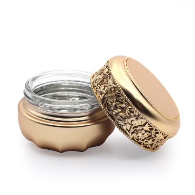 China Empty Luxury Glass Cosmetic Container Jar 30g 50g Gold Stamping Embossment Jar for sale