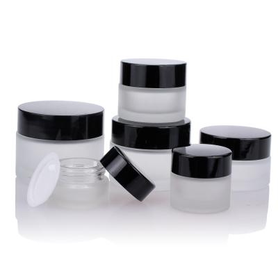 China Round Cream Glass Jars Frosted 10g 20g 30g With Black Plastic Cap for sale