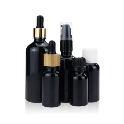 China Empty Violet Black Dropper Screw Cap Glass Bottle for Essential Oil Hair Oil for sale