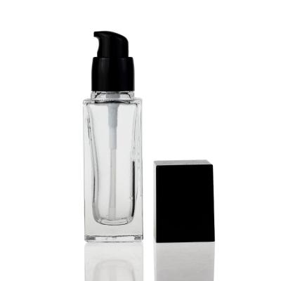 China 40ml Clear Square Glass Liquid Foundation Bottles With Pump Black Cover for sale