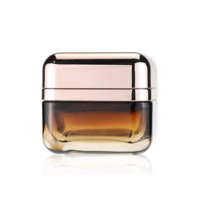 China 50g Square Shape Amber Glass Jar Empty Cream Container With Rose Gold Cap for sale
