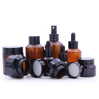 China 50g Glass Cosmetic Bottle Set Unique Cream Packaging Amber Glass Jar With Lid for sale